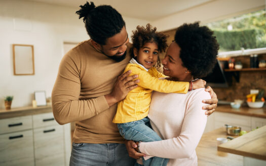 Happy black family enjoying in time they are spending together at home.